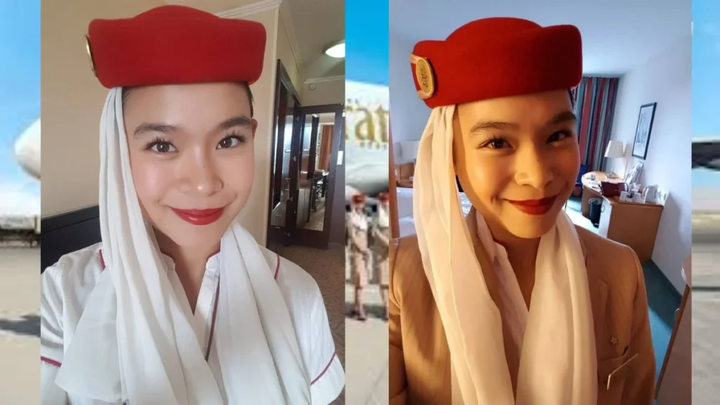 pramugari-fly-emirates-tersenyum-di-hotel - Indo Archive Pramugari Fly Emirates tersenyum mengenakan seragam resmi merah di dalam kamar hotel, representasi profesionalisme awak kabin internasional